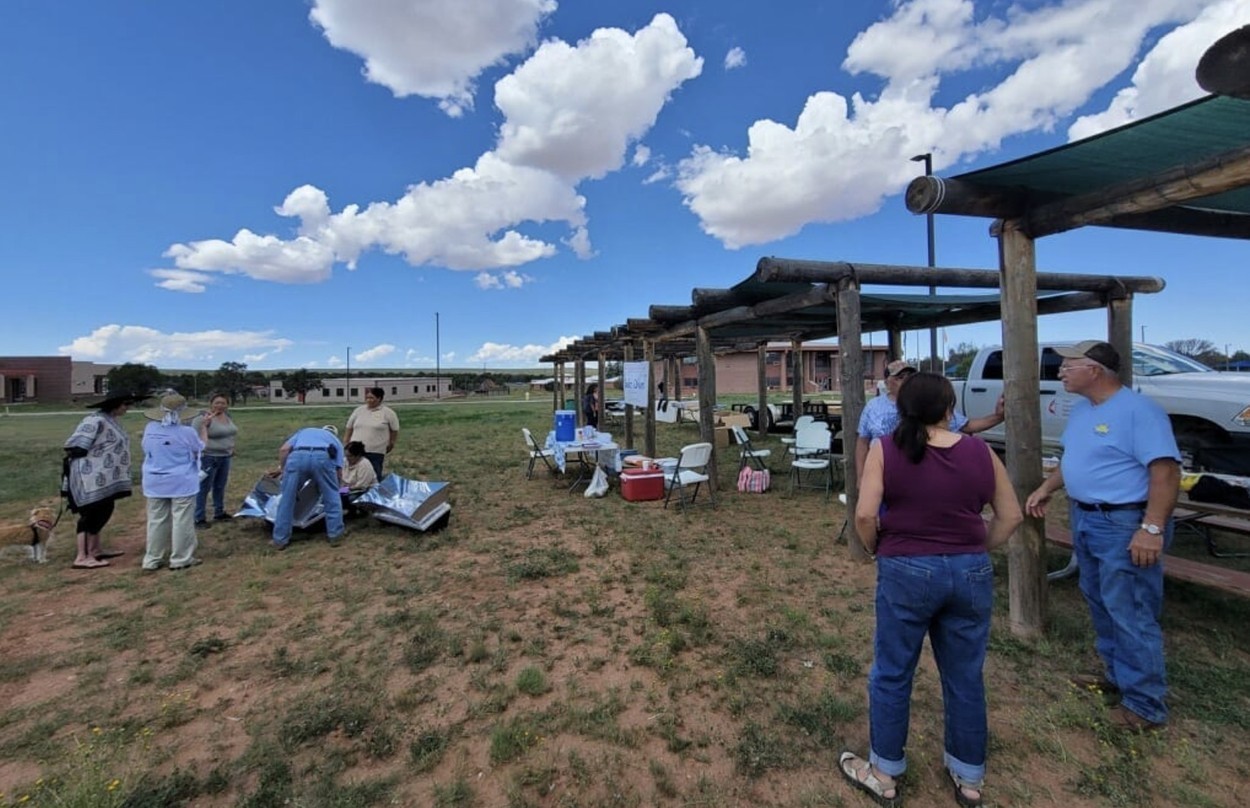 people learning to use a solar oven in AZ