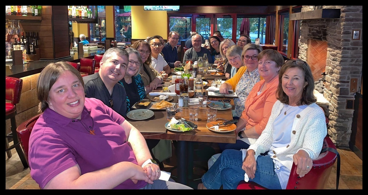 pastors and leaders seated at restaurant table