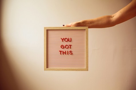 Hand on letterboard