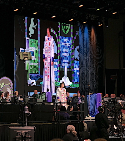 Bishop preaching in large convention hall