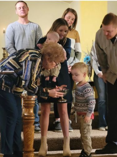 Pastor baptizing child