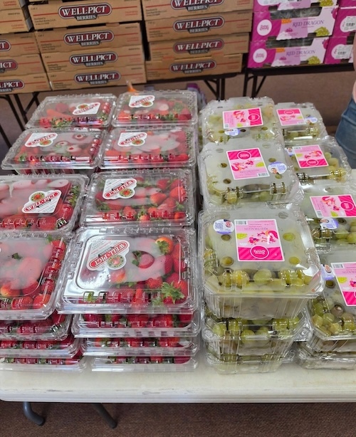 cartons of strawberries and grapes